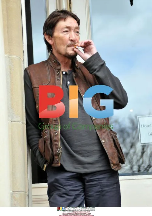 Chris Rea Takes Cigarette Break in Glasgow
