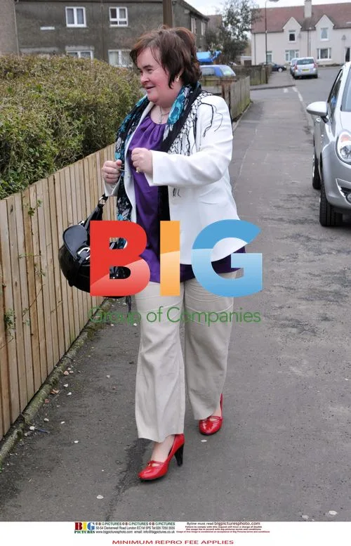 Susan Boyle Poses Outside Home