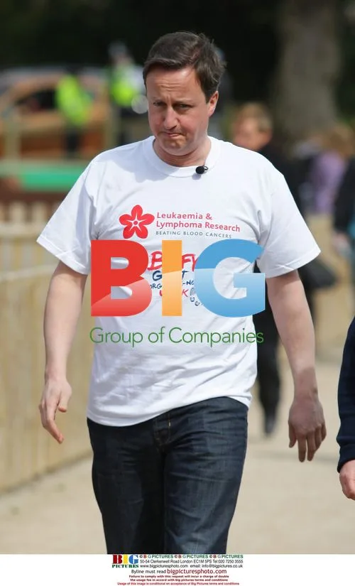 David Cameron joins Sir Ian Botham for charity walk