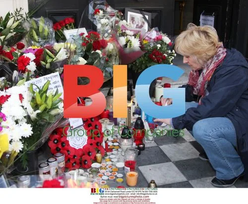 Mourners gather at Polish Embassy in London