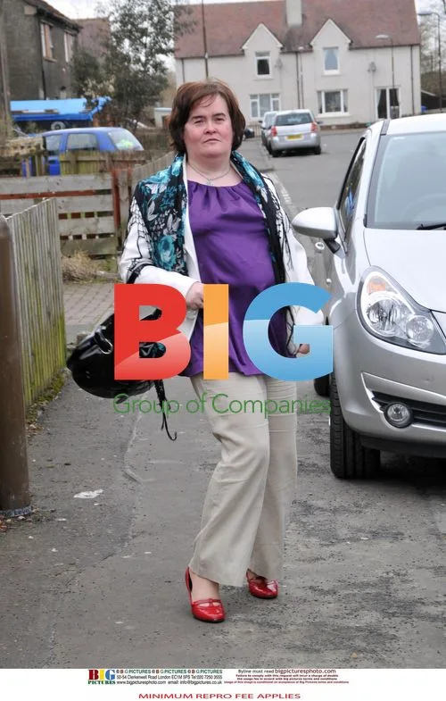 Susan Boyle Poses Outside Home