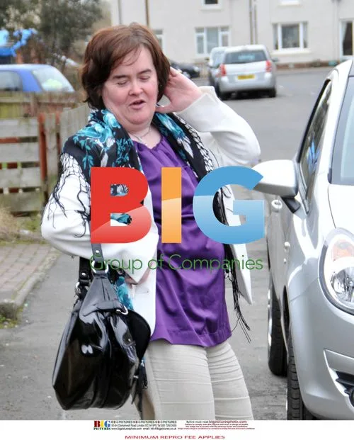 Susan Boyle Poses Outside Home