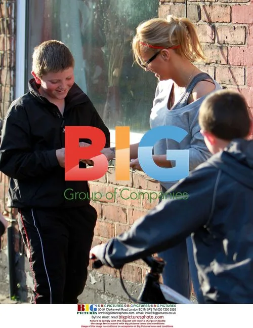 Kerry Katona Kisses Schoolboy in Warrington