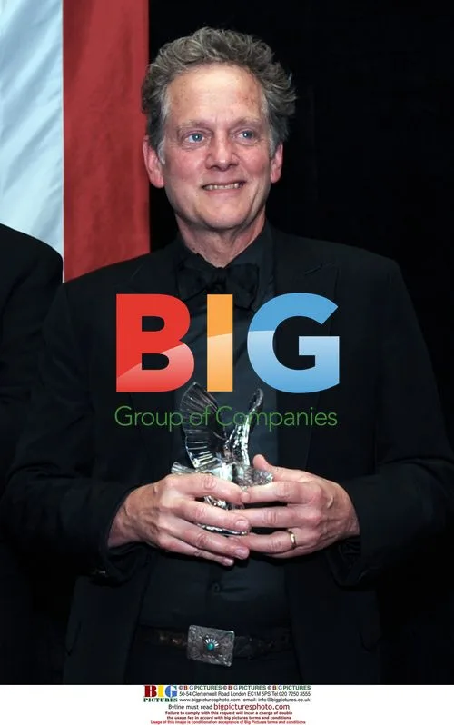 Michael Bacon Holds USO Merit Award