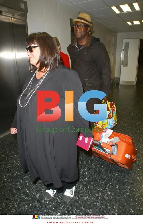 Lenny Henry and Dawn French Return from Caribbean