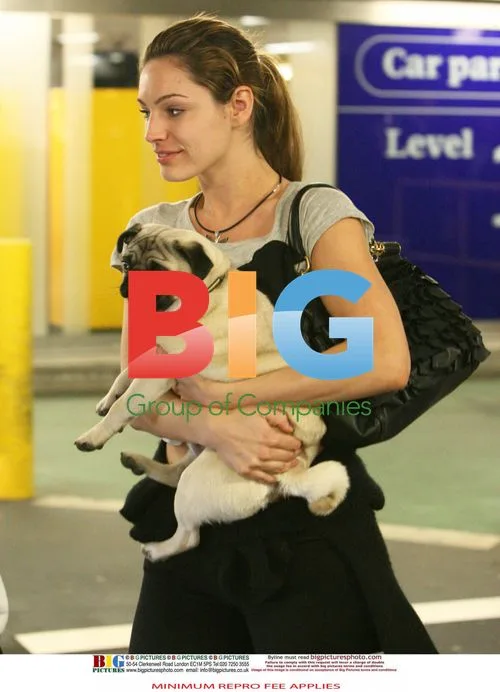 Kelly Brook Arrives at Heathrow