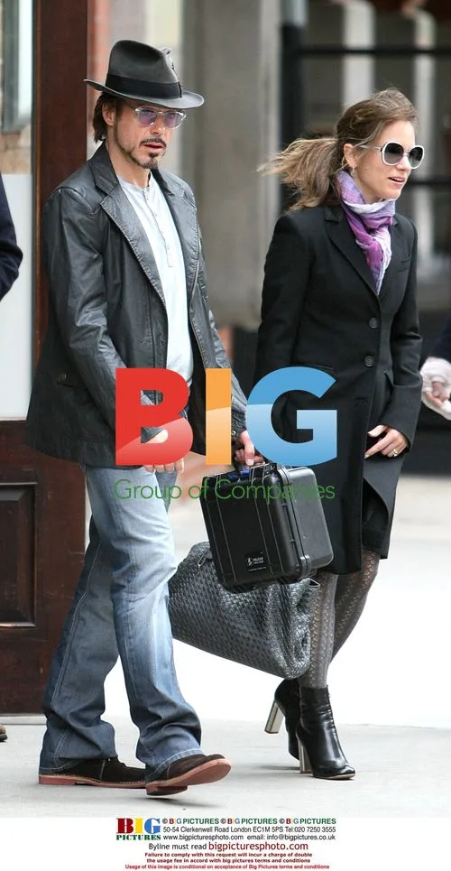 Robert Downey Jr. Leaves Hotel with Wife