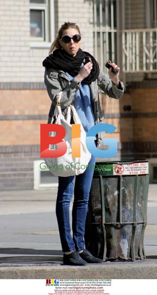 Whitney Port hails a taxi in NYC