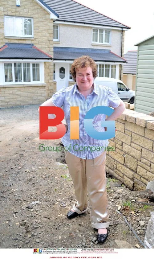 Susan Boyle with Workmen at New Home