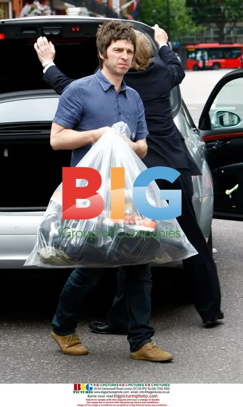 Noel Gallagher Arrives Home with Trainers