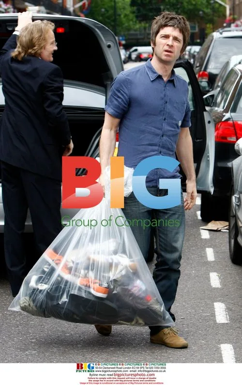 Noel Gallagher Arrives Home with Trainers
