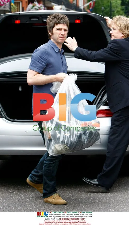 Noel Gallagher Arrives Home with Trainers