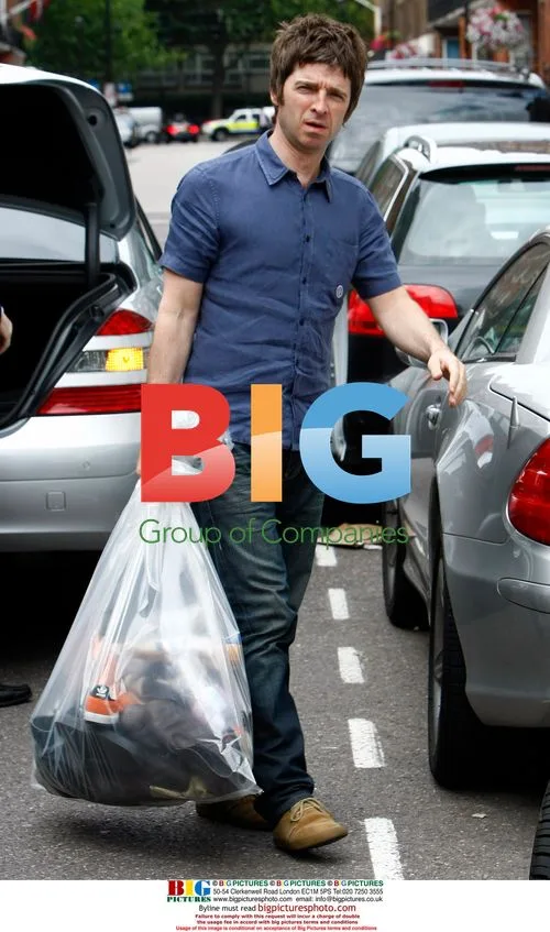 Noel Gallagher Arriving Home With Trainers