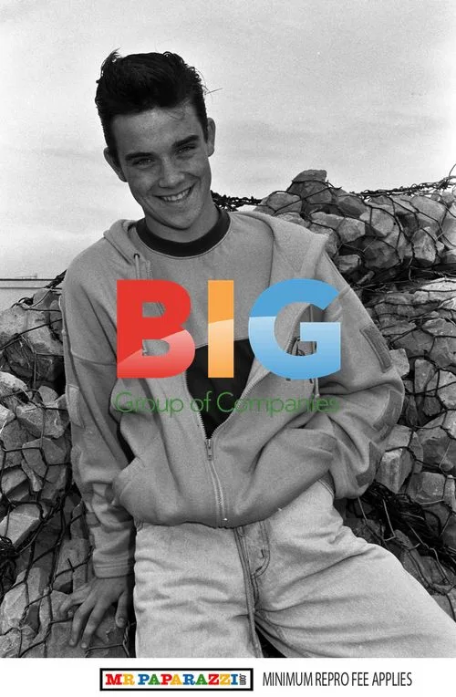 Robbie Williams joins Take That at holiday camp