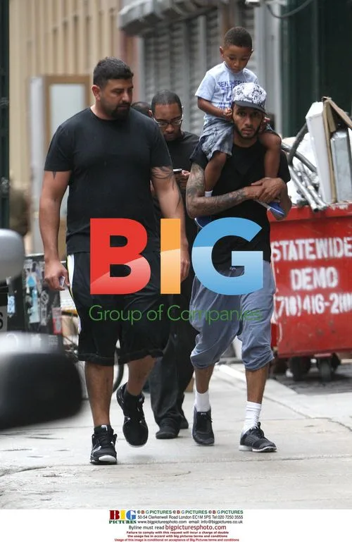 Swizz Beatz Walks Through Soho With Son