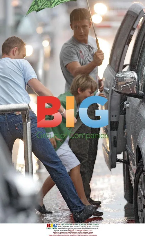 Liz Hurley and Family Arrive at Nice Airport