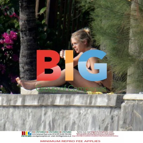 Chelsy Davy Relaxes on Beach Vacation
