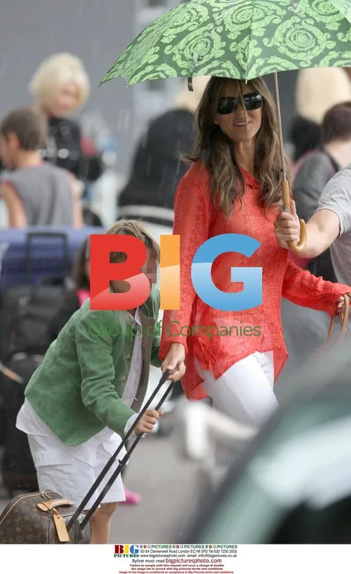 Liz Hurley, Arun Nayar and Damian at Nice Airport