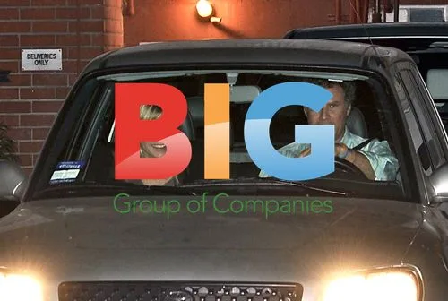 Will Ferrell and Viveca Paulin in electric SUV