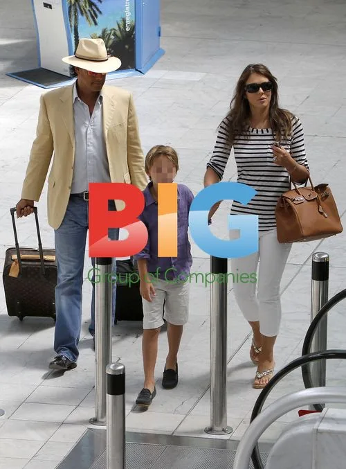 Liz Hurley Departs France with Family