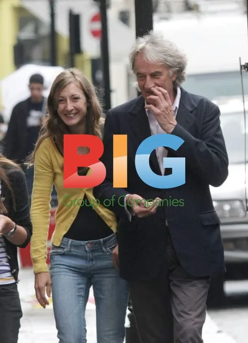 Paul Smith strolling with female companion in Covent Garden