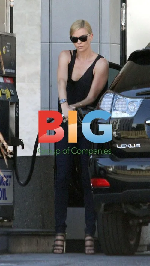 Charlize Theron Pumping Gas in LA