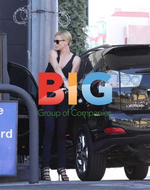 Charlize Theron Pumping Gas in Los Angeles