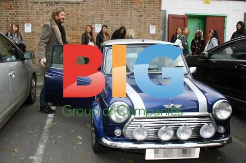 Simon Le Bon Gets Coat Caught in Mini Cooper