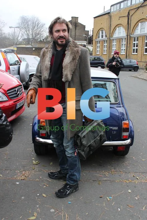 Simon Le Bon struggles to enter Mini Cooper at studio