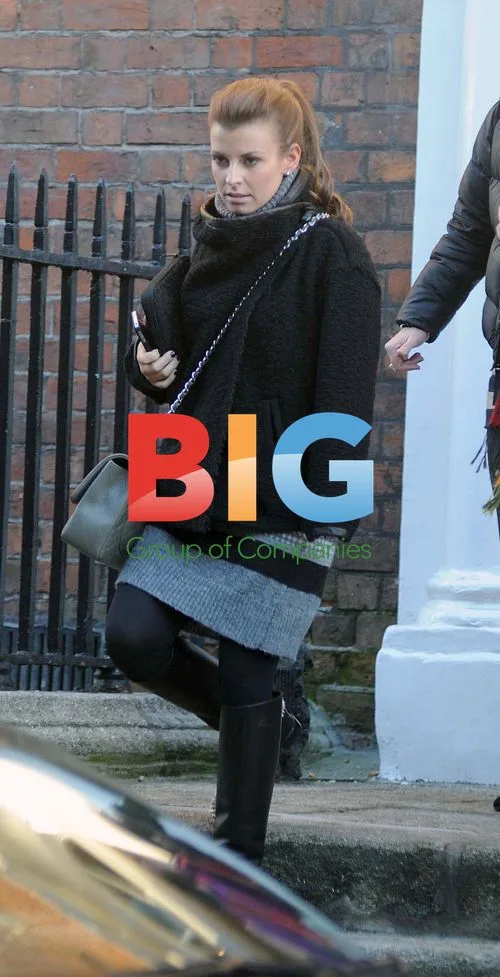 Coleen Rooney in Dublin with Louboutin Boots