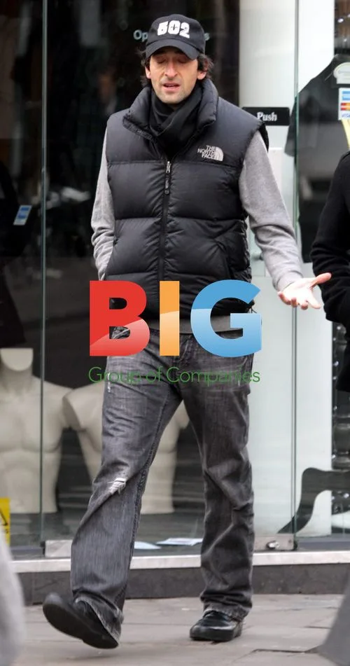 Adrien Brody Walks with Friends in London