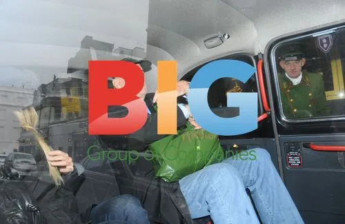 John Cleese and Mystery Lady Hail Cab in London