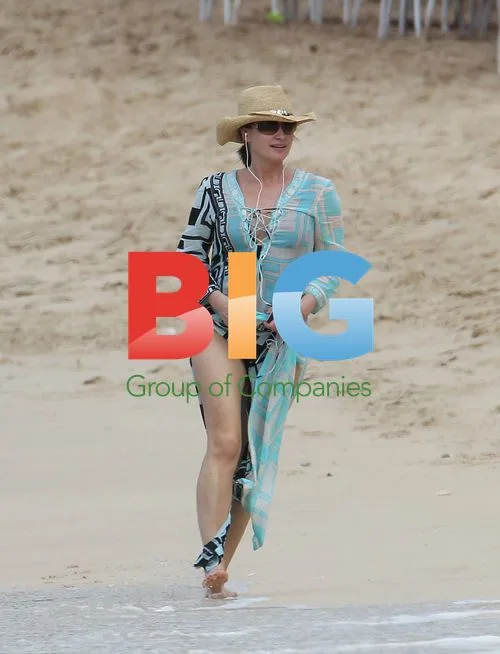 Emma Forbes Enjoys Beach Stroll in Caribbean