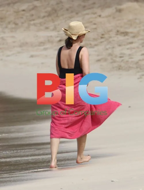Emma Forbes Walks on Caribbean Beach