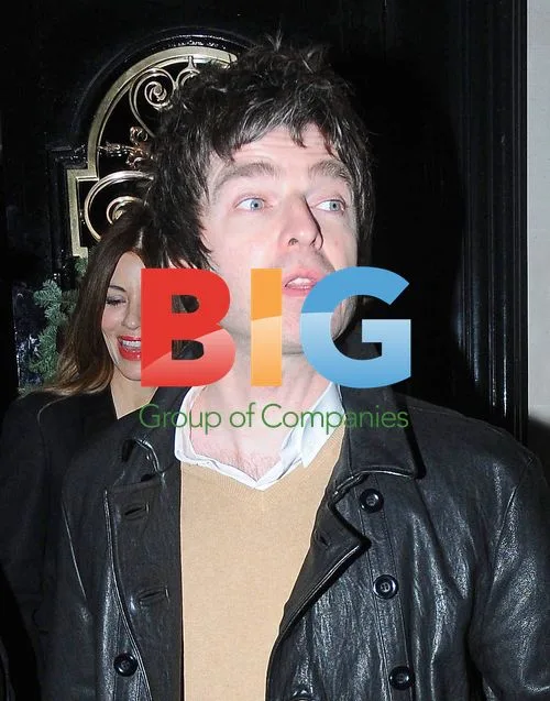 Noel Gallagher and Sara MacDonald leaving restaurant