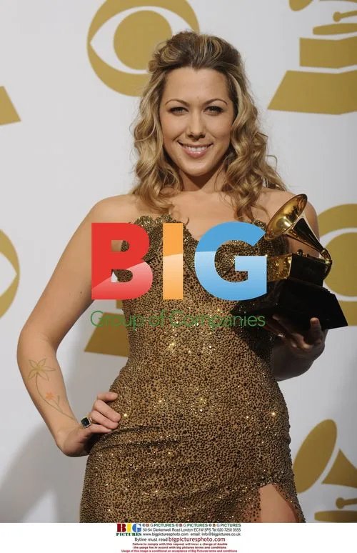 Colbie Caillat holds Grammy backstage