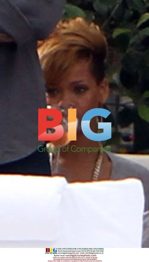 Rihanna Relaxes Poolside With Friends