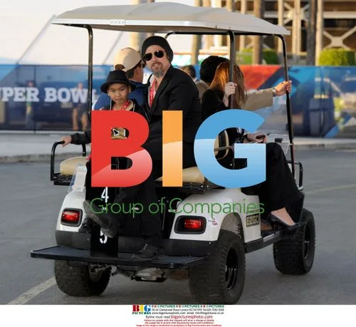 Brad Pitt with son Maddox at Super Bowl XLIV