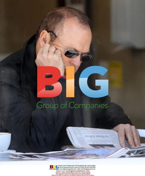 Michael Keaton Enjoys Coffee and Newspaper