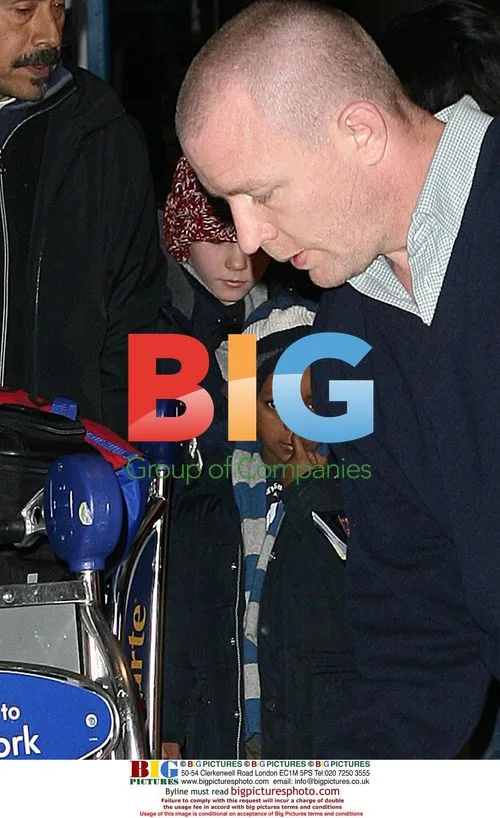 Guy Ritchie with sons at JFK airport