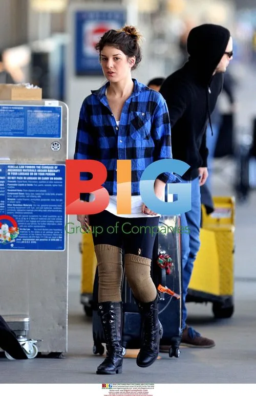 Shenae Grimes arrives at LAX with boyfriend