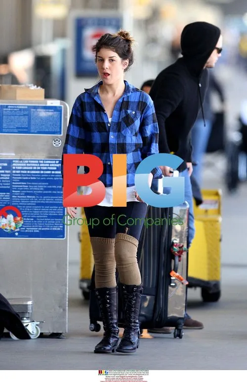 Shenae Grimes and boyfriend arrive at LAX