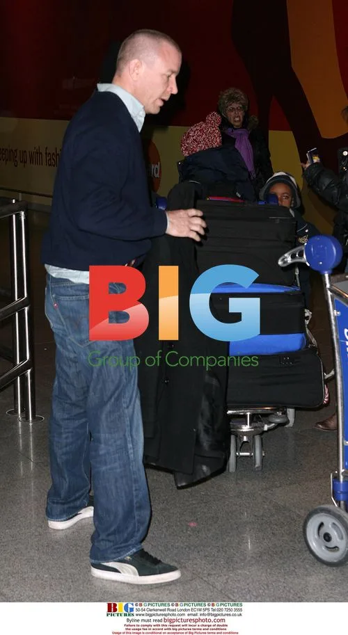 Guy Ritchie Arrives at JFK with Sons