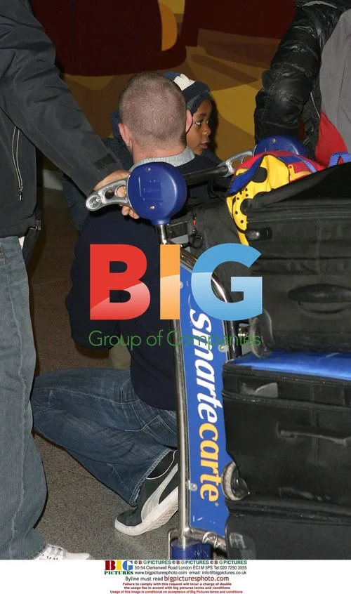 Guy Ritchie with sons at JFK airport