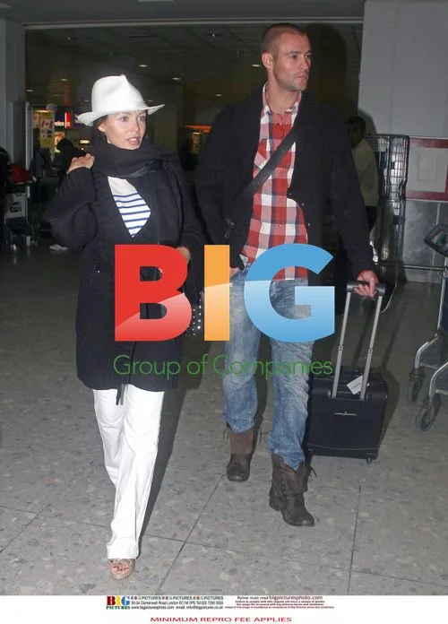 Dannii Minogue and Kris Smith Arrive at Heathrow