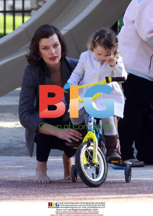 Milla Jovovich and Daughter Play at Park