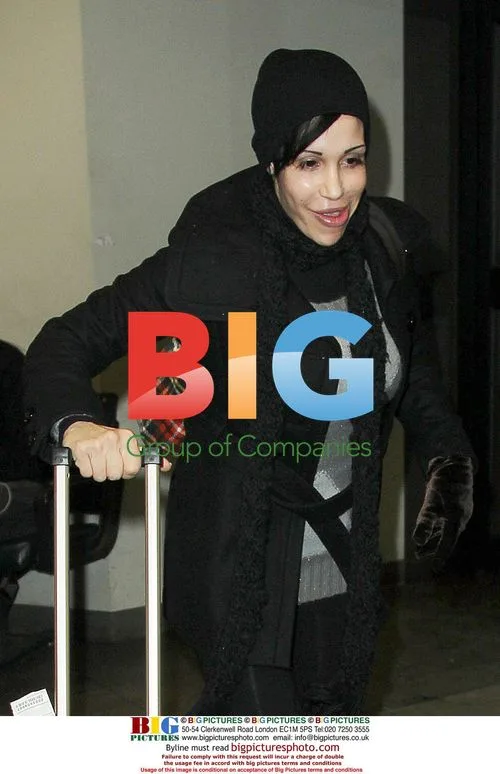 Octomom Makes Faces at JFK Airport