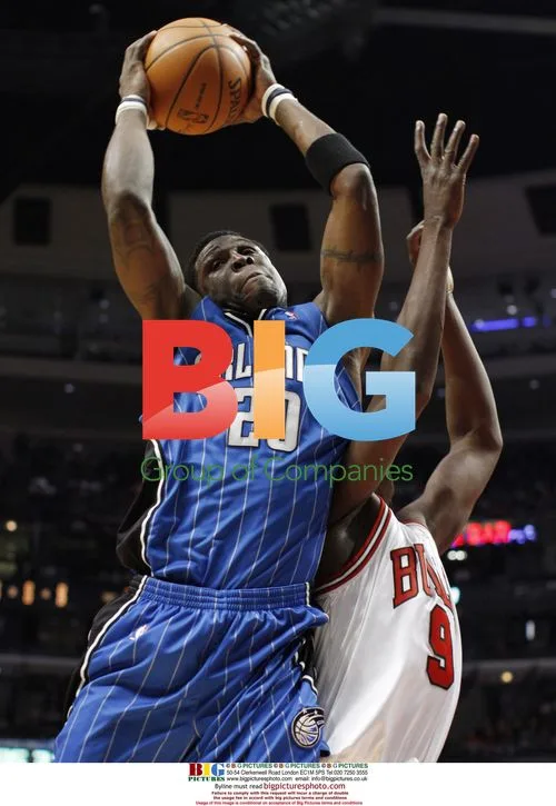 Mickael Pietrus grabs rebound from Luol Deng