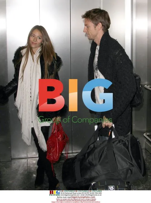 Jenson Button Arrives at Heathrow Airport