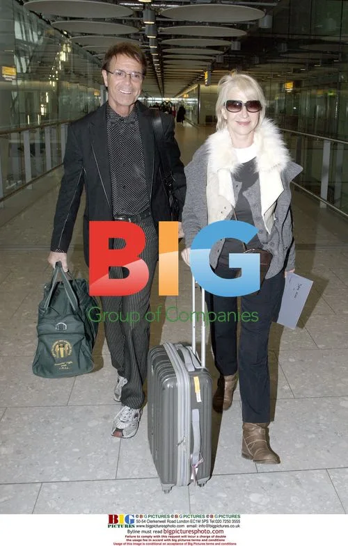 Sir Cliff Richard and Dame Helen Mirren at Heathrow